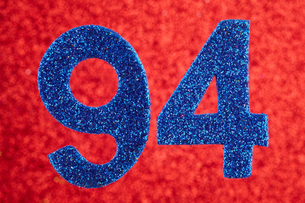 istock Number ninety-four blue color over a red background. Anniversary. 661444546