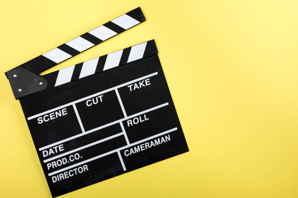 istock top view of movie clapper board on yellow 661450148