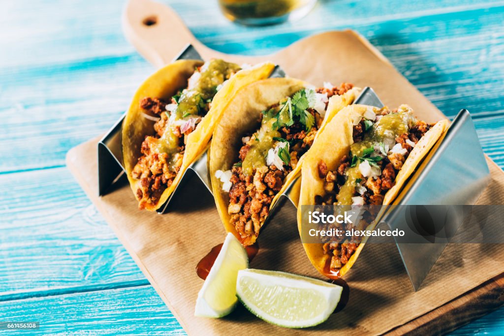 Mexican tacos campechanos Tasty mexican tacos  with beer on a wooden table. Taco Stock Photo