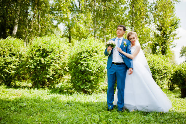 istock wedding couple in love walking in park 661456136
