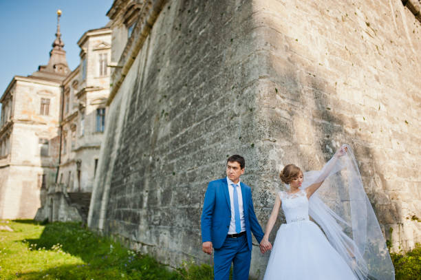 istock Tender wedding couple background old architecture of castle 661460394