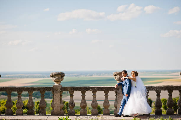 istock Tender wedding couple background old architecture of castle 661460596