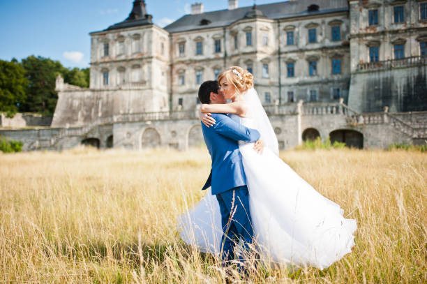 istock Tender wedding couple background old architecture of castle 661460632