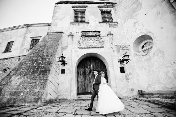 istock Tender wedding couple background old architecture of castle 661460782