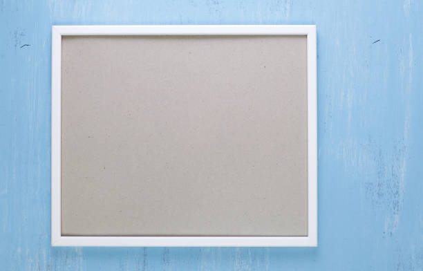 istock Blank photo frame on blue wood background. 661464380