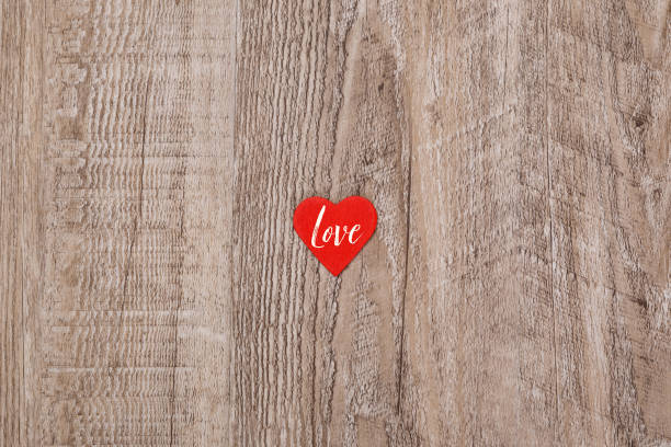 istock Red heart on wooden background. Love design. 661467472
