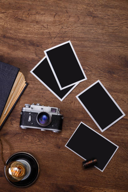 istock Vintage photo camera. Blank photo frames. 661468262