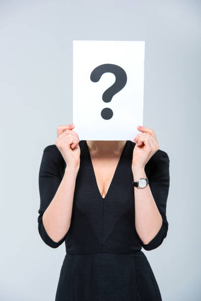 istock Woman holding card with question mark 661468342