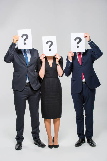 istock Businesspeople holding cards 661474074