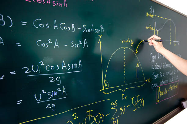 hand writing complicated math equation Closeup of hand writing complicated math equation on black board. algebra photos stock pictures, royalty-free photos & images