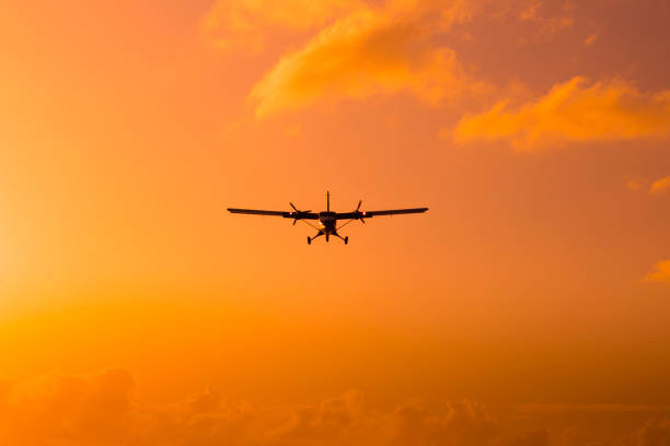 istock Silhouette of an airplane at sunset. 661477822