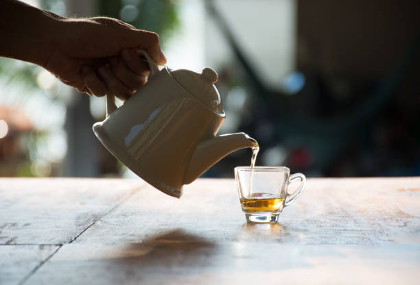 istock Pouring the black tea in a glass 661481542