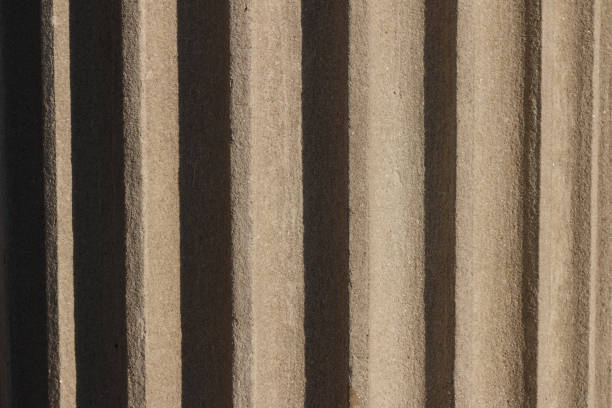 istock Fragment of the column with flutes. Bright sun reveals details. 661506092