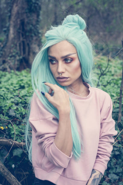 istock Girl with mint wig outdoor. 661506336
