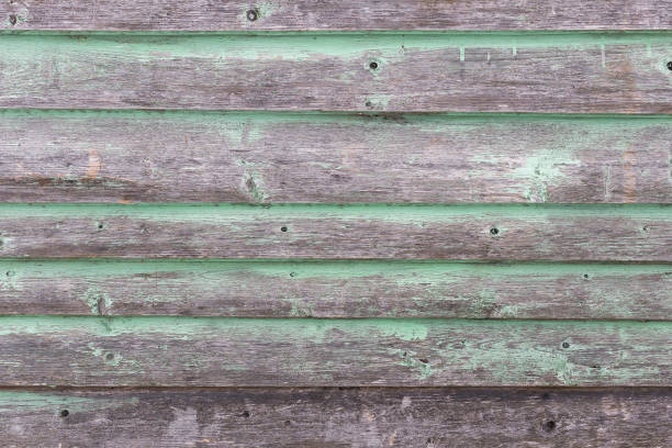 istock The old green wood texture with natural patterns 661510846