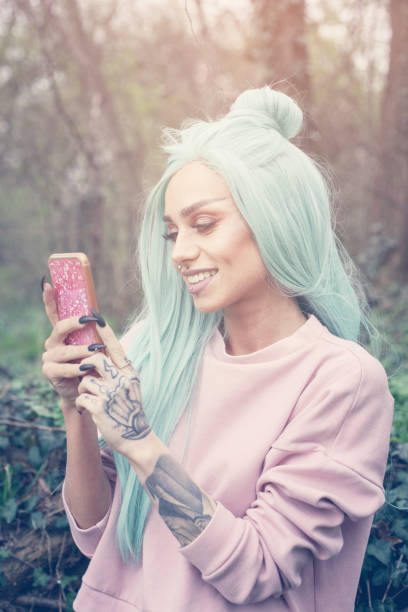 istock Girl with mint wig outdoor. 661513094