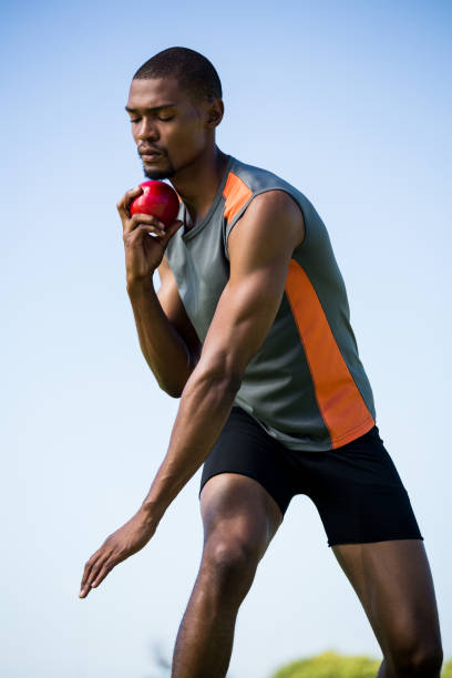 istock Athlete about to throw shot put ball 661513260
