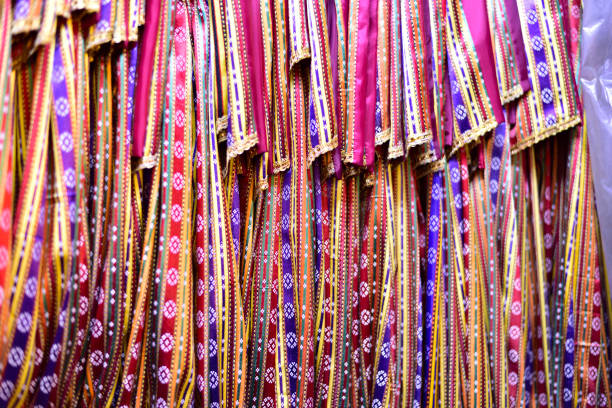Kutnu is a woven textile with a shiny surface and colourful vertical stripes, made with silk warps and cotton wefts in it's hometown Gaziantep, Turkey.