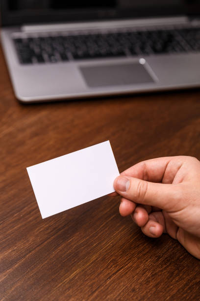 istock Hand hold blank business card design mockup. 661514542