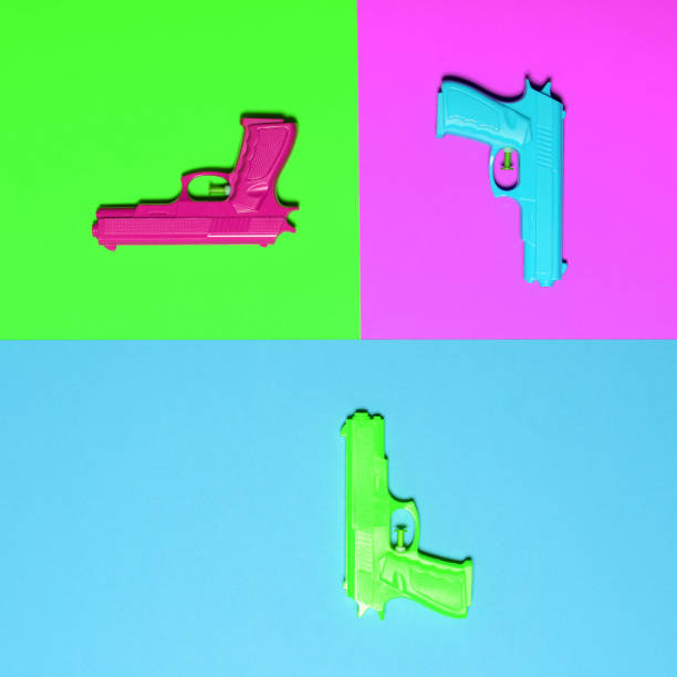 istock Toy pistols on colorful background  - Minimal design top view 661515936
