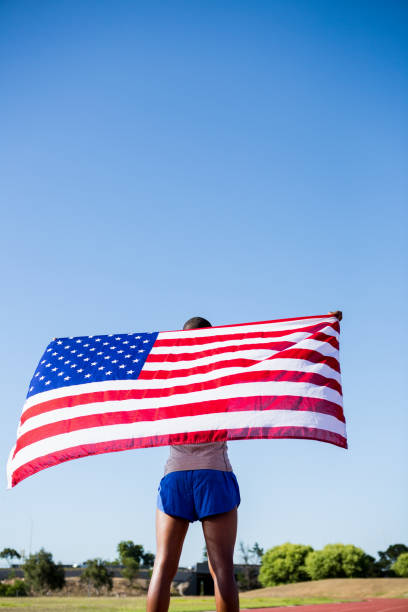 istock Athlete holding an american flag 661515942