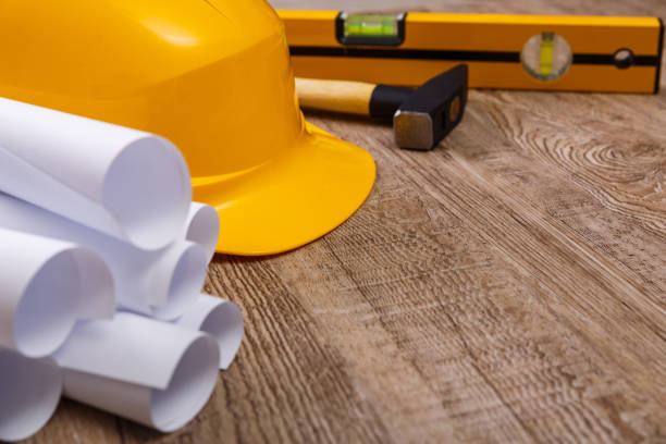 istock Helmet, hammer and building level. 661533166