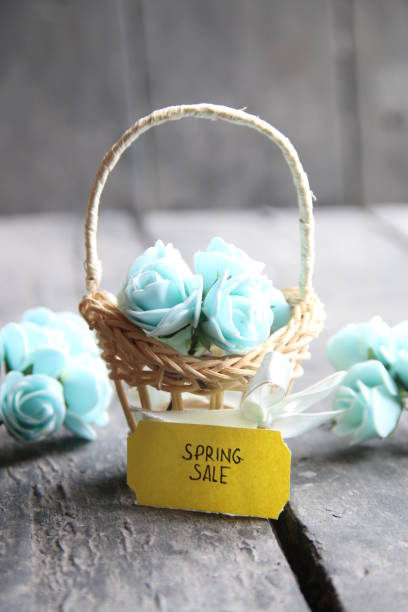 istock spring sale tag and flowers in a small basket 661538098