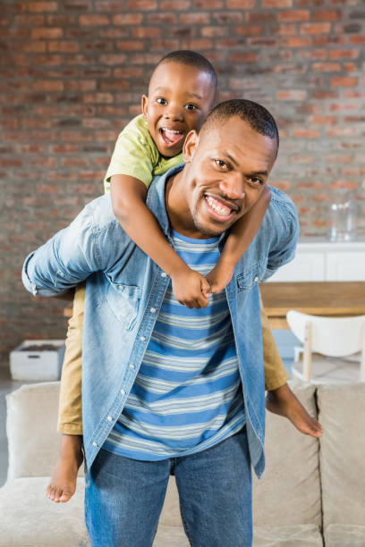 istock Father and son having fun at home 661545154