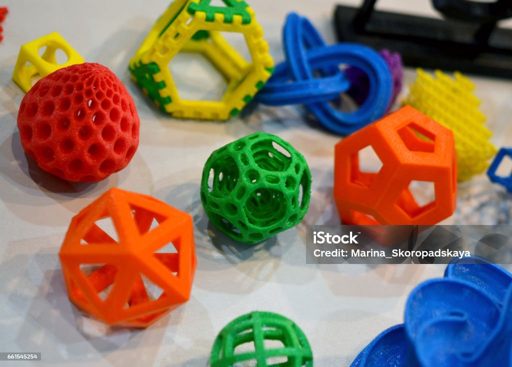 Objects printed by 3d printer Objects printed by 3d printer. Bright colorful objects printed on a 3d printer on a table 3D Printing Stock Photo