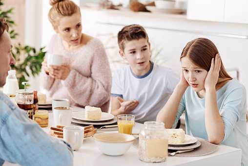Depressed Girl Having Breakfast With Her Family Stock Photo - Download ...