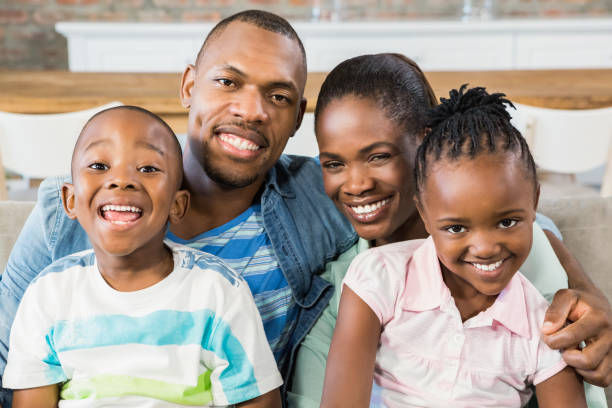 istock Happy family relaxing on the couch 661546620