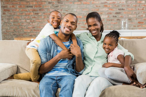 istock Happy family relaxing on the couch 661546768