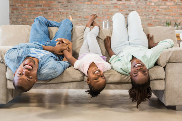 istock Happy family relaxing on the couch 661547382