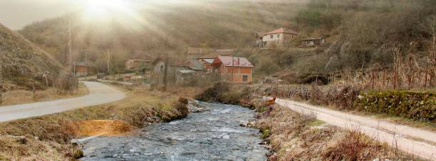 istock sunrise over village river 661555776