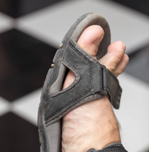 istock male foot in sandals 661556360