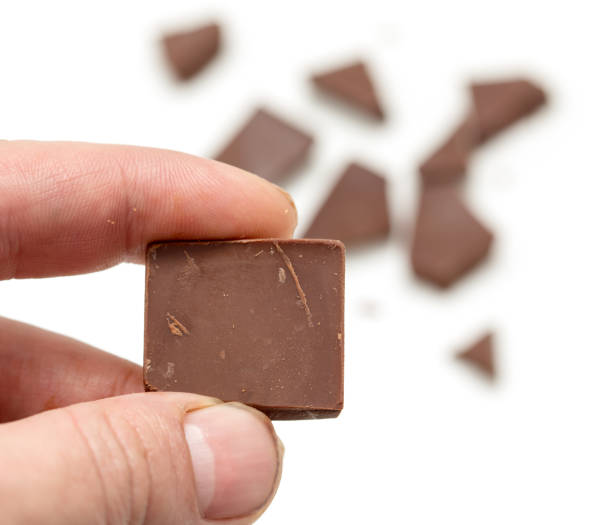 istock chocolate in his hand on a white background 661560854