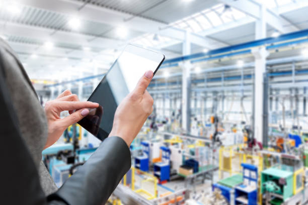 istock Female manager in factory & tablet 661563204