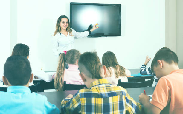 istock children with teacher in classroom 661580680