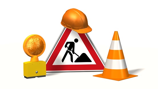 Construction site, construction site sign with pylons safety helmet and warning light isolated on white