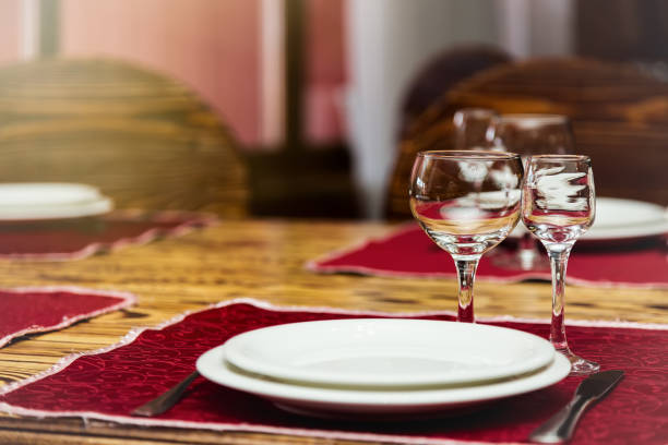 istock Empty glasses set with plate and knife in restaurant 661590794