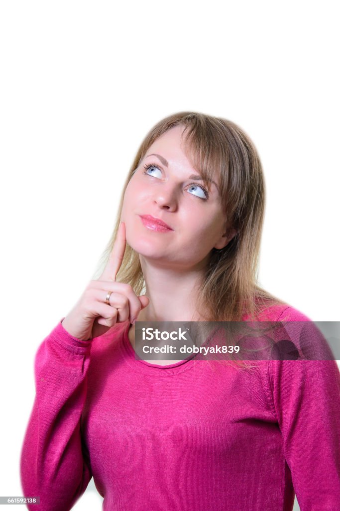 Portrait of a pensive girl. Finger at the cheek Portrait of a pensive girl. Finger at the cheek. Isolated Adult Stock Photo