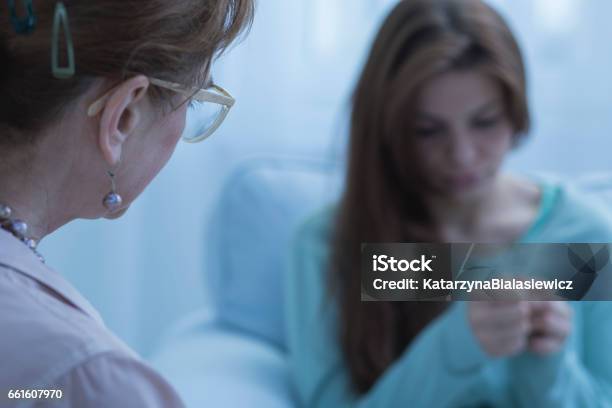 Woman With Depression Having Help Stock Photo - Download Image Now - Psychiatric Hospital, Mental Illness, Distraught