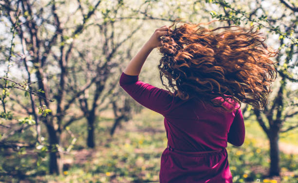 Young woman in nature in spring