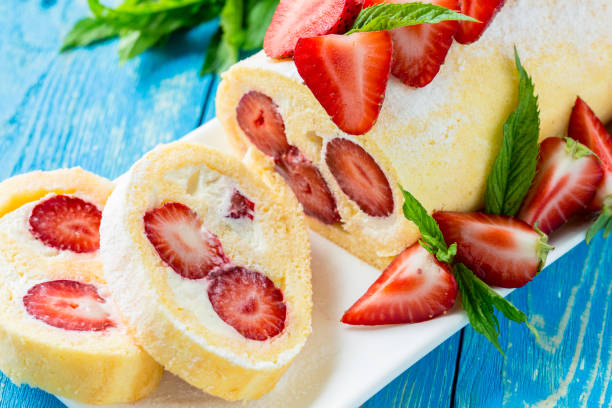 istock Homemade swiss roll biscuit cake with strawberries 661617368