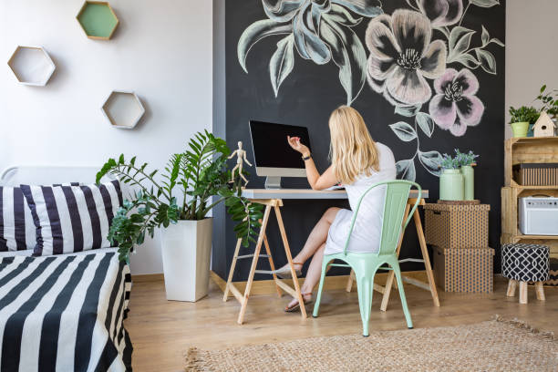 istock Woman sitting at her desk 661663420