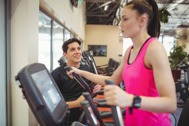 istock Fit woman working out with trainer 661671116