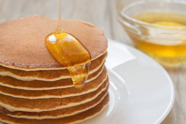 istock Tasty pancakes with honey for breakfast 661671258
