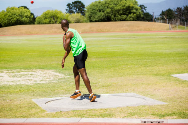 istock Male athlete throwing shot put ball 661673170