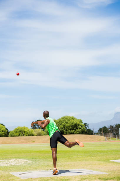 istock Male athlete throwing shot put ball 661673870