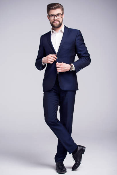 istock Handsome man in dark blue suit white shirt 661674216